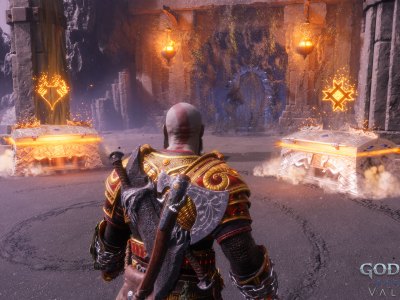 Kratos stood in front of two chests in the God of War Ragnarok: Valhalla DLC