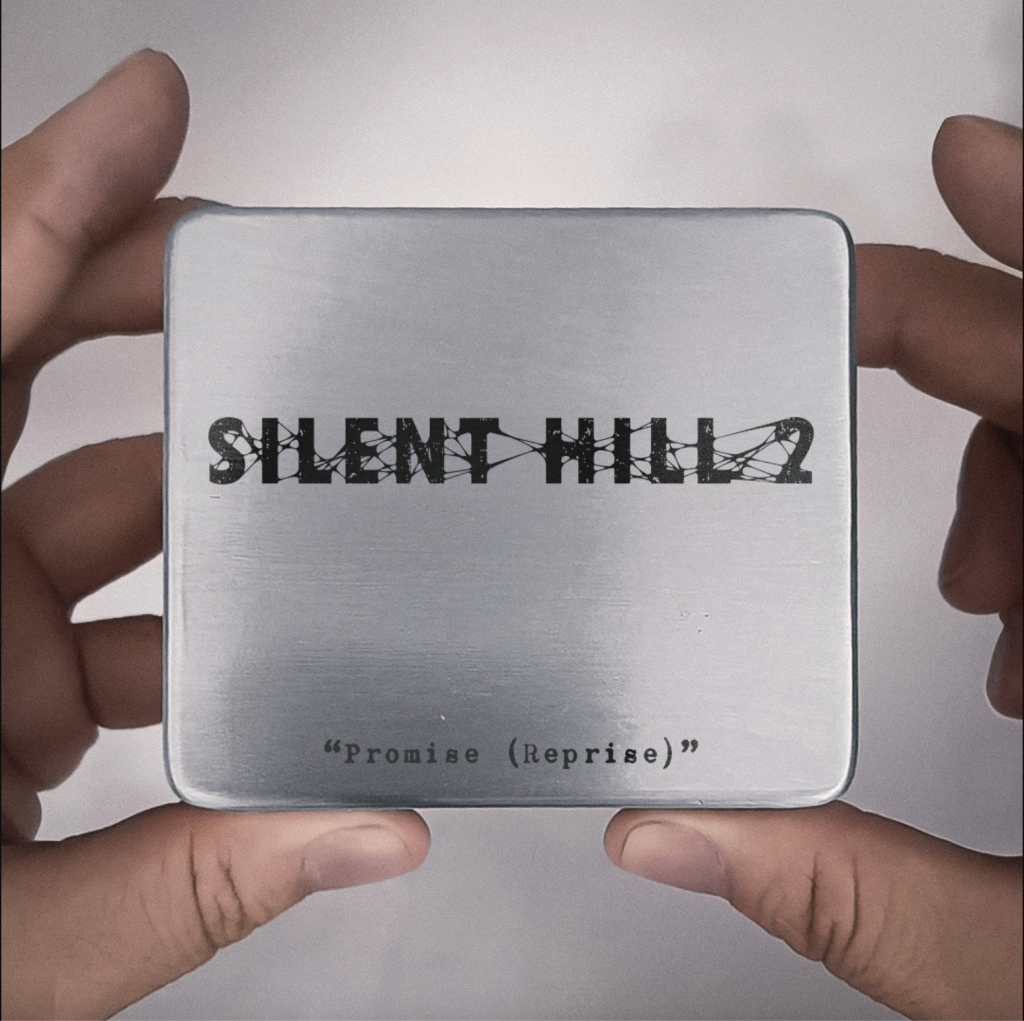 hands holding the Silent Hill 2 Music Box, top down with the title showing