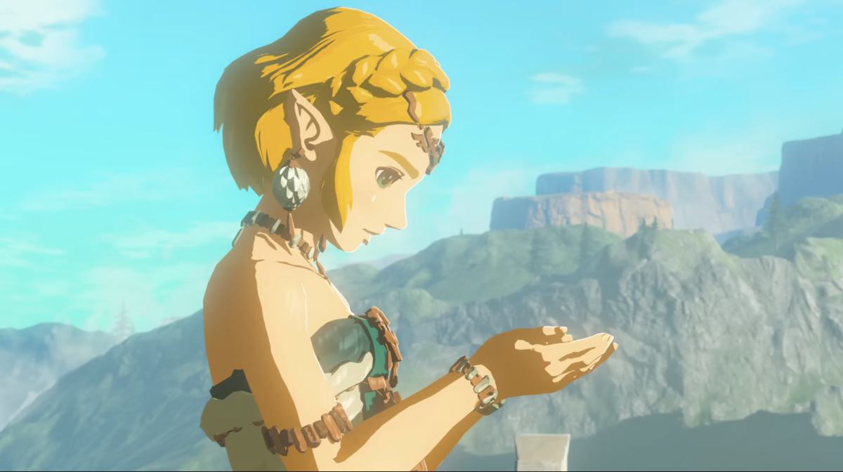 Image of Princess Zelda in Tears of the Kingdom looking at something in her hands