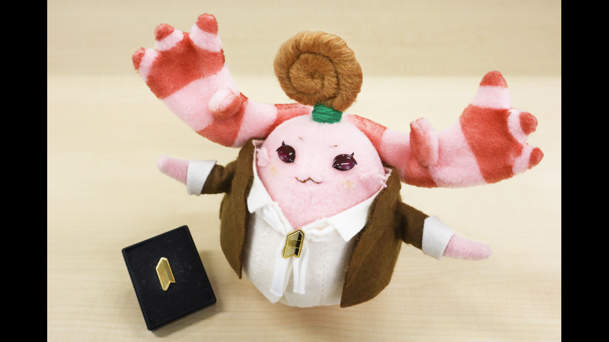 Monopon reveals Monolith Soft company emblem badge IRL