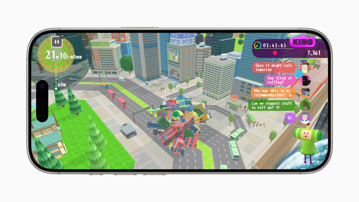 Screenshot from Katamari Damacy Rolling Live. The Prince is live streaming pushing a large Katamari through a town.